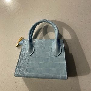 Very very tiny blue bag